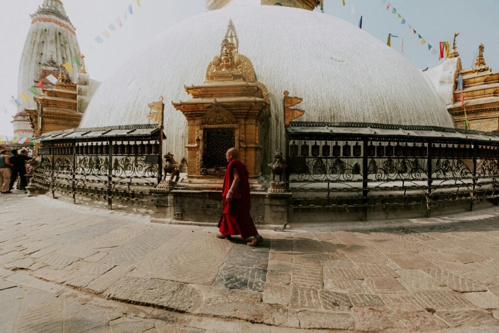 A Monk walking throw the Monkey temple in Kathmandu, Nepal